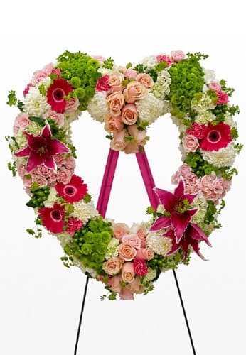 Sympathy Heart - Beautiful floral tribute- heart with green kermit poms hot pink oriental lilies, peach and blush roses, white carnations and green hydpericum