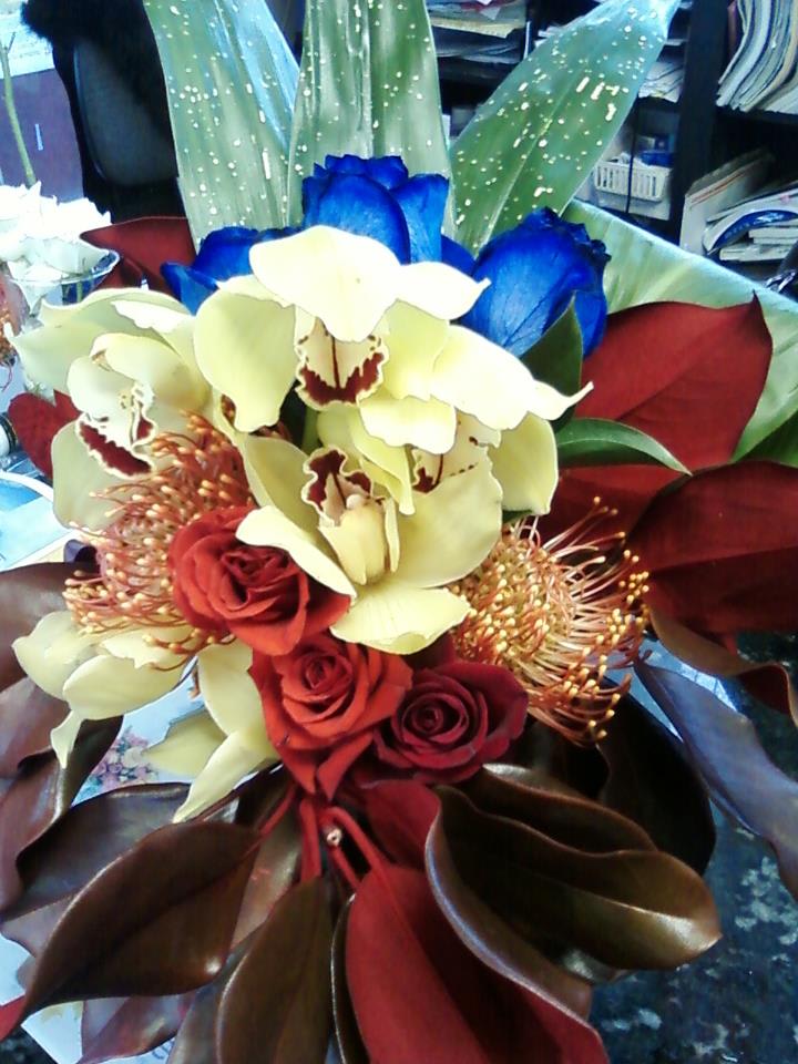 Exotica - protea, cymbidium and blue roses are the perfect and a unique mix bouquet ever !