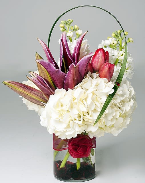 Moment of Love - mix bouquet with variety of hydrangeas, asiatic lily, snap dragons and tuiips with a touch of unique design