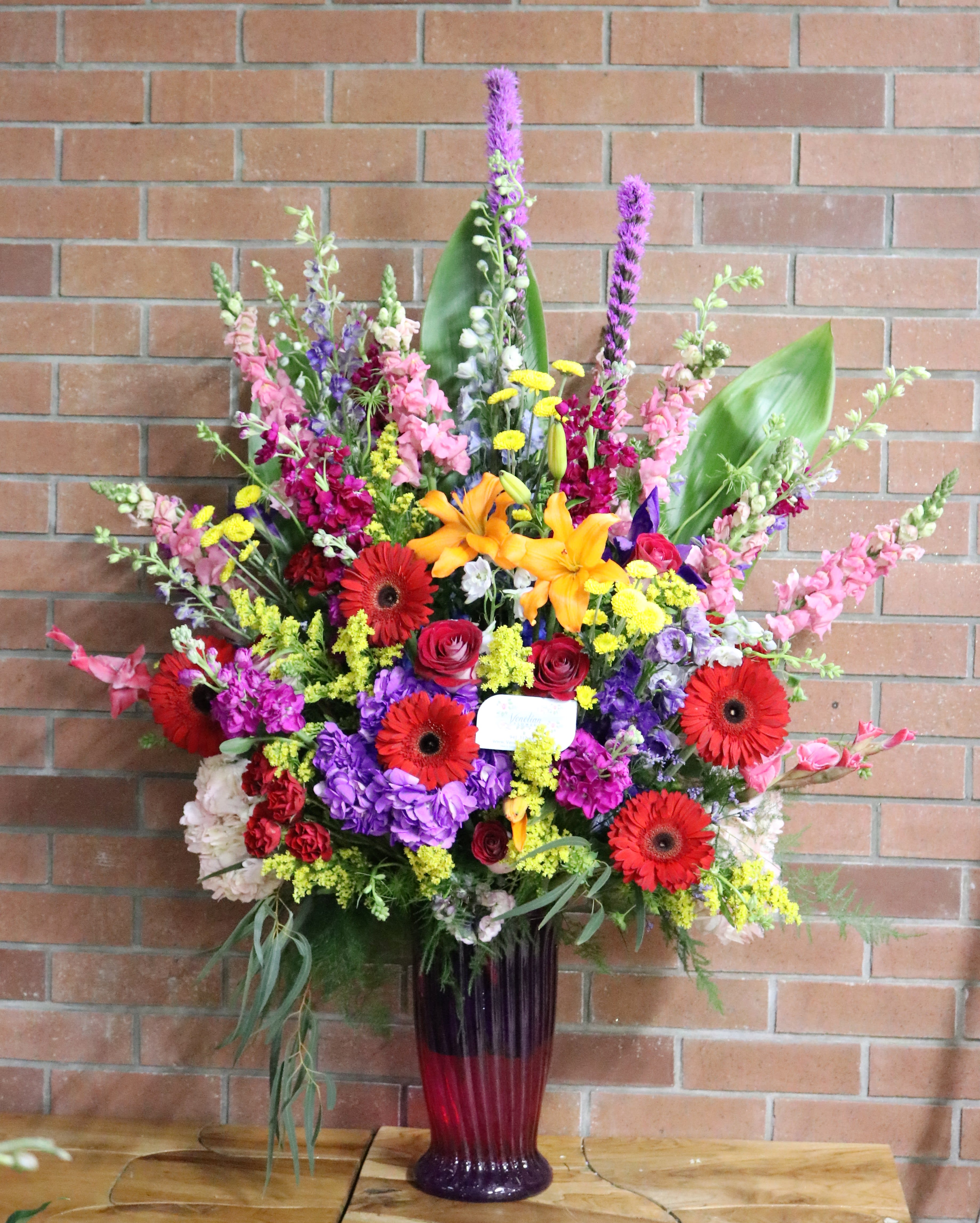 Garden Of Color Funeral Arrangement in Venice, FL Flowers