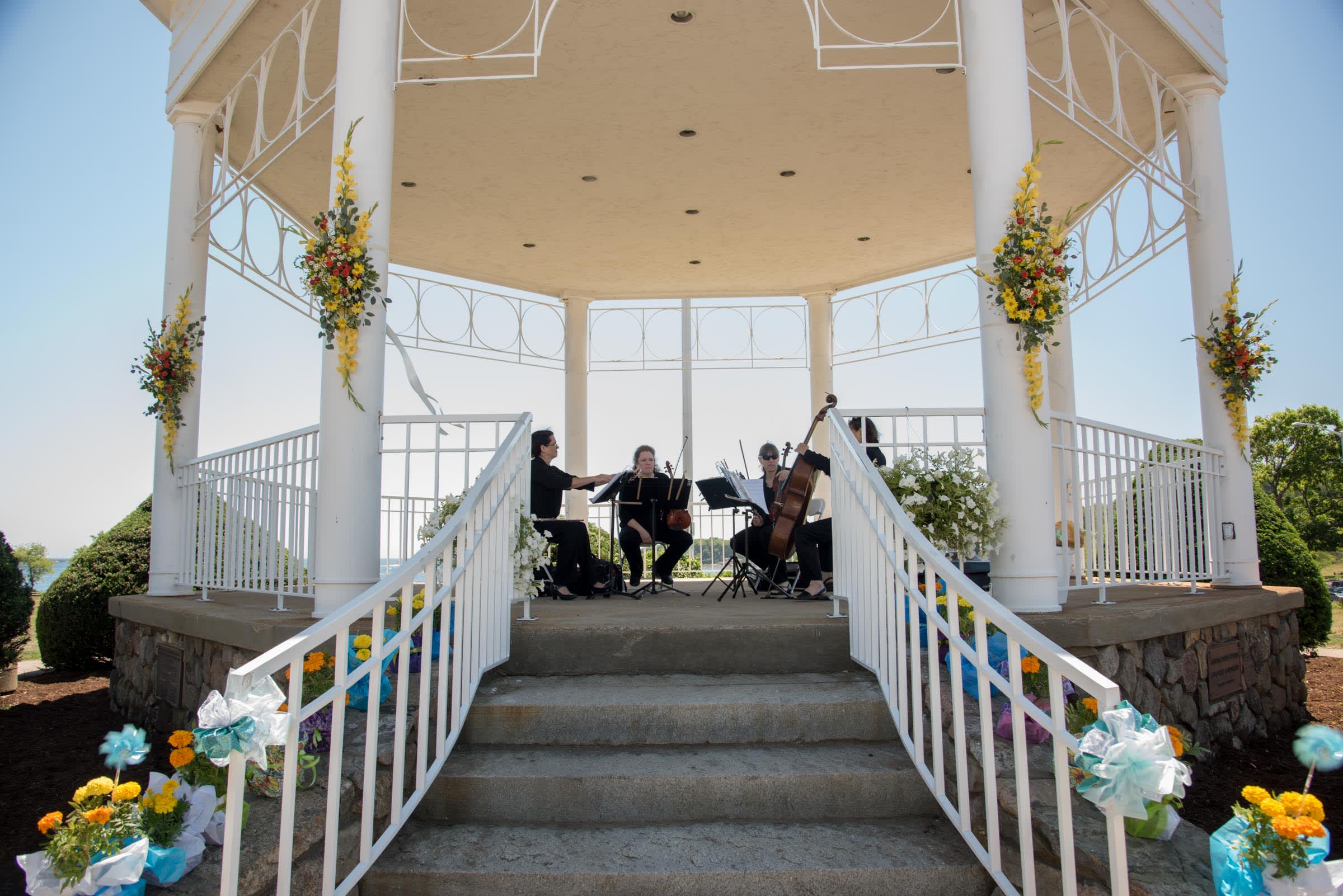 Fresh Wedding Spray Bouquets for a Gazebo - We will customize your fresh blooms to match the florals of  your choice. Sprays shown are arranged with bright gladiola, spray roses, freesia, vibrant daisies and roses. Call us or email us to discuss your special day. Pricing is for each spray.