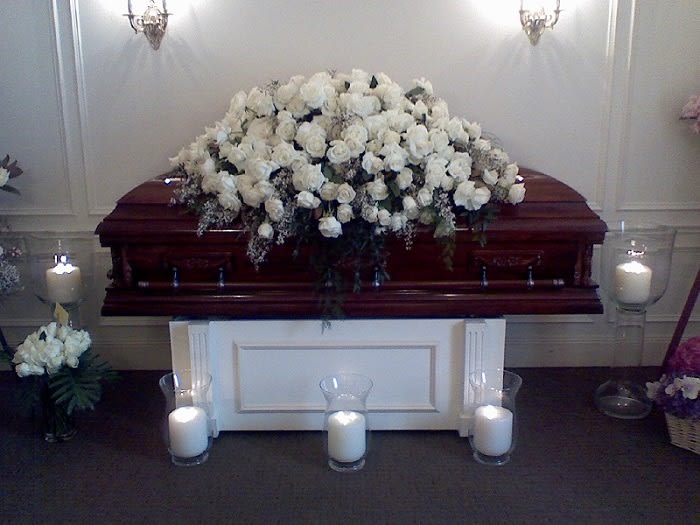 White casket spray - White rose casket spray that flow down the side of the casket