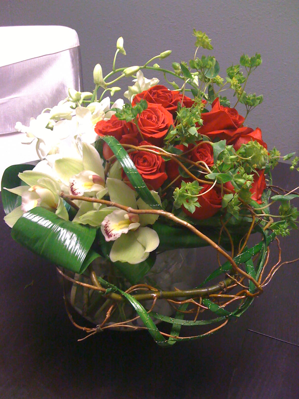 Endless Love - Red Roses nestled in with orchids and willow.