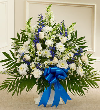 Tribute Blue &amp; White Floor Basket Arrangement - Product ID: 91208   Our elegant floor basket arrangement is a heartfelt way to express your deepest sympathies for their loss. With blue flowers to symbolize tranquility and white flowers to symbolize peace, this beautiful gathering of fresh roses, snapdragons, blue delphinium and more conveys all the care and concern you feel for them during this difficult time. Floor basket arrangement of fresh white roses, snapdragons, carnations, blue delphinium and more Appropriate for family, friends or business associates to send directly to the funeral home Our florists use only the freshest flowers available, so colors and varieties may vary Large arrangement measures approximately 32&quot;H x 42&quot;L Medium arrangement measures approximately 32&quot;H x 40&quot;L Small arrangement measures approximately 32&quot;H x 36&quot;L