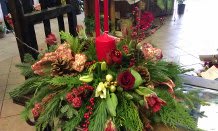 holiday greens centerpiece with candle holiday greens centerpiece with candle - fragrant centepiece with unscented candle featuring pine cones, cedar, pine.