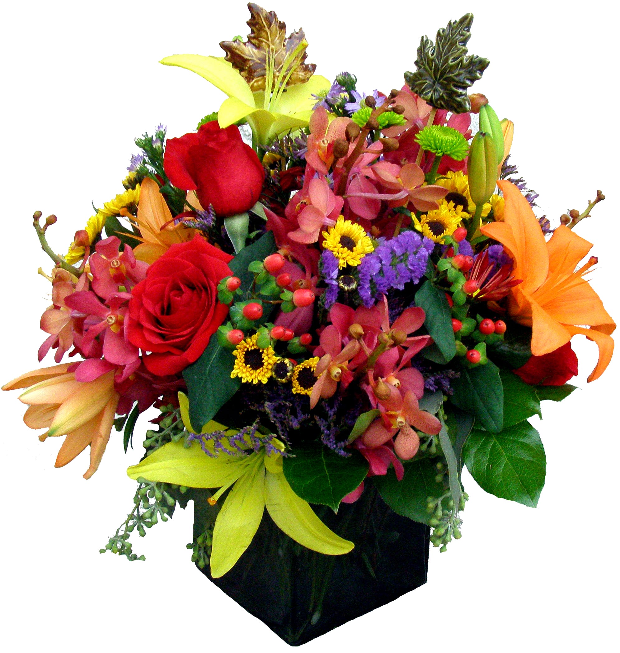 Autumn Spectacular Autumn Spectacular - Our handcrafted fall-colored cube filled with the rich colors of autumn. Roses, lilies, orchids, and chrysanthemums highlight this beautiful design. The finishing touches include two ceramic fall leaves.