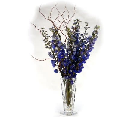 Crystal Delphinium Crystal Delphinium - Blue Dutch Delphinium designed with curly willow in Godinger's Shannon Vase. This sophisticated vase is handcrafted in cut crystal.