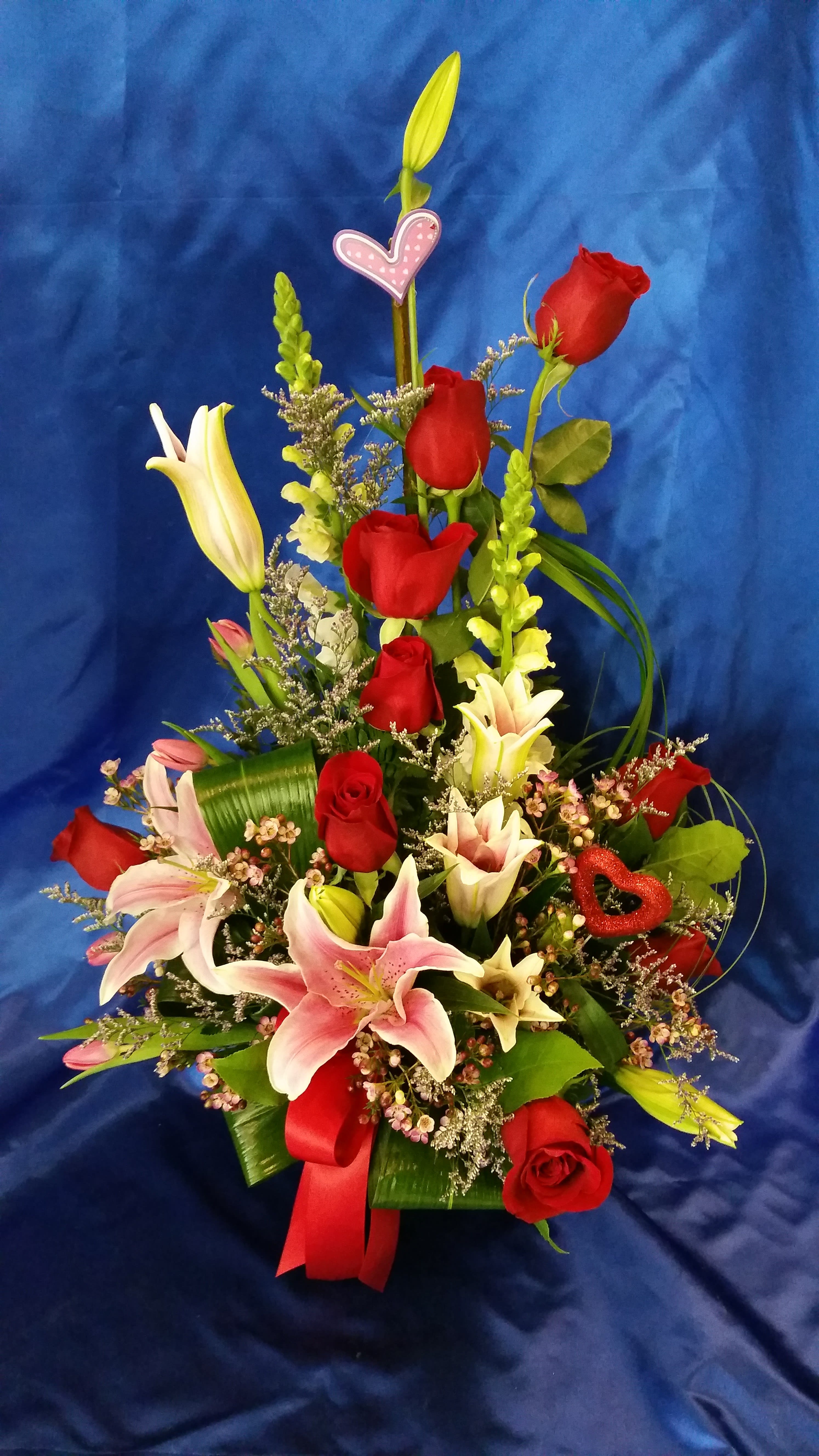 basket with red roses and lilies - red roses, pink lilies and snap dragon