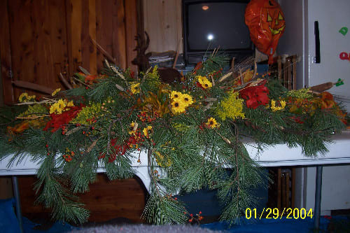 Forest Casket Spray Forest Casket Spray - Nature Greens with fall leaves, solidago, wheat, cattails, curly willow, salai, berries, miniature sunflower, red gerber daisy