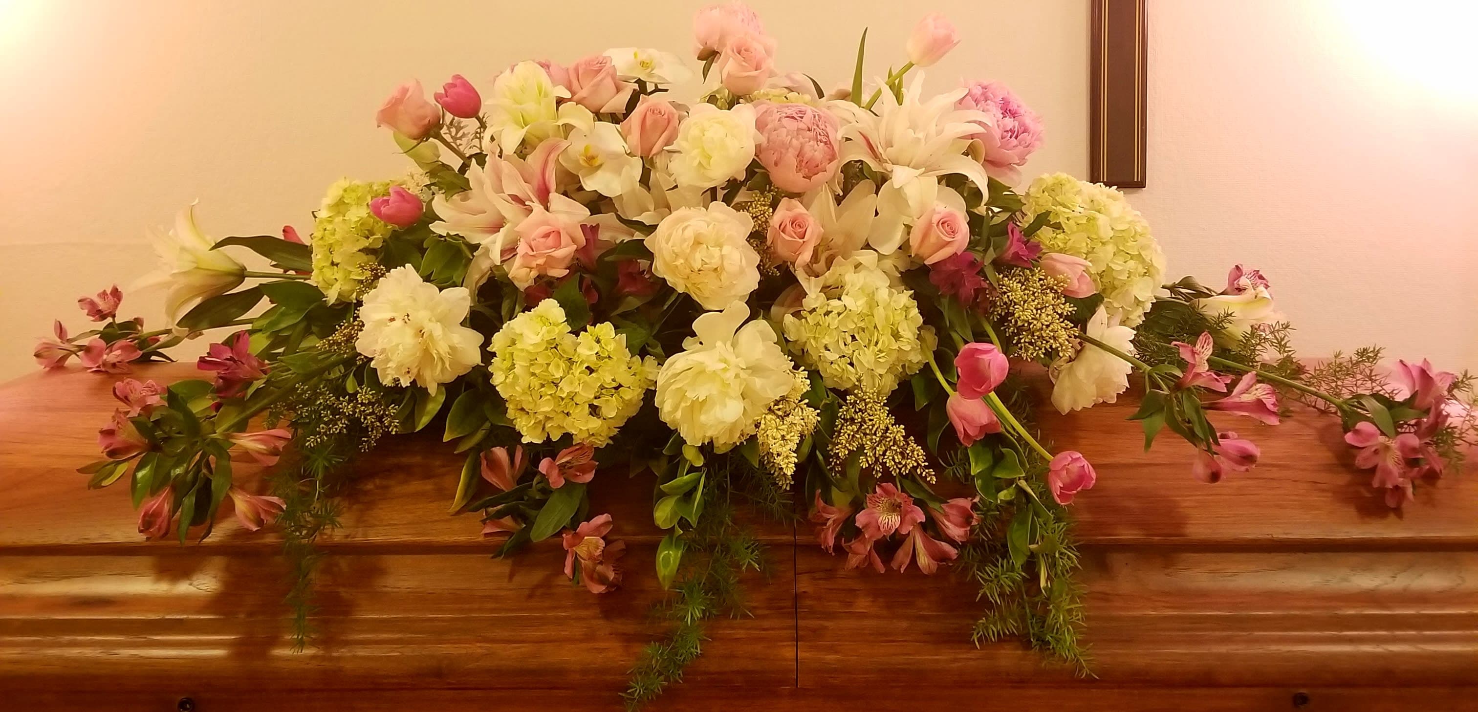 Serene Goodby - Soft flowing pink and white florals for the perfect farewell to your loved one. Colors can be changed to represent your loved one's life.