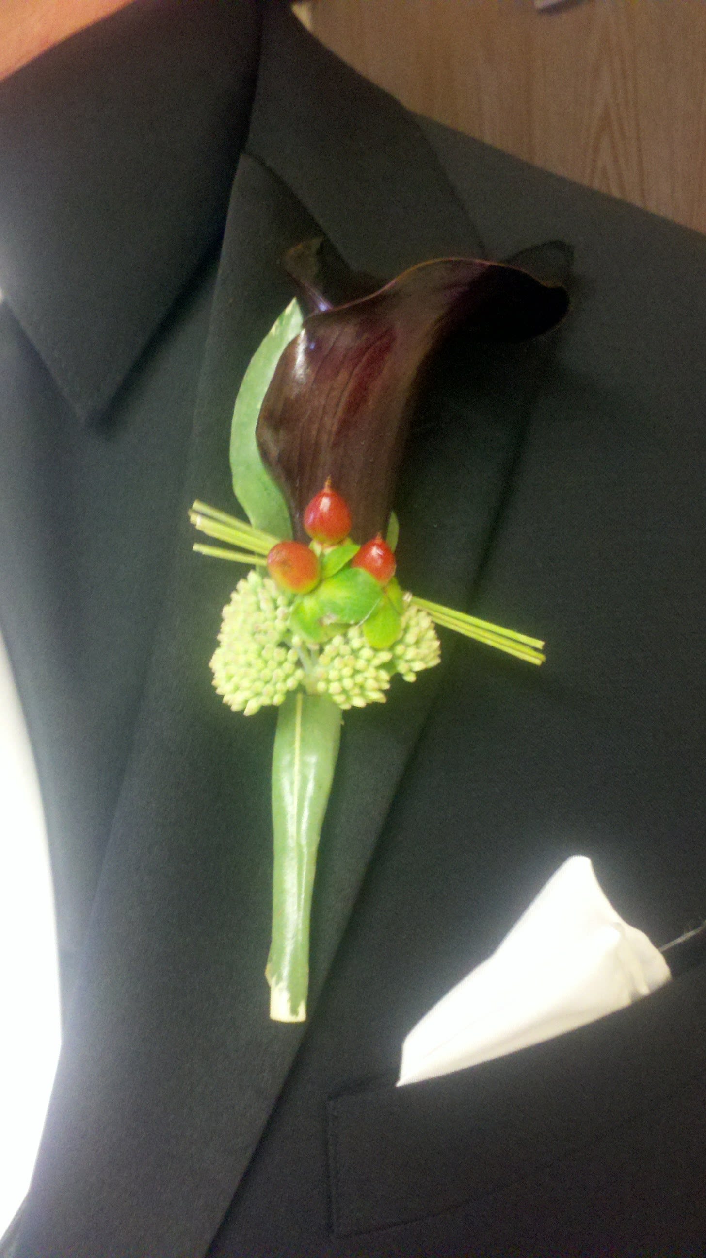 Cool Boutonniere - A creative addition to your wedding party.  The natural touches are an asset to your overall look.