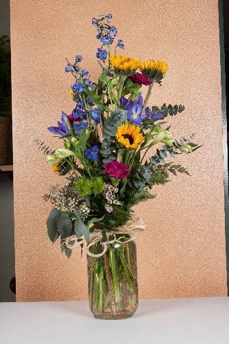 In a Mason Jar In a Mason Jar - Fresh cuts in a mason jar. Choose your flowers, and let us design it.