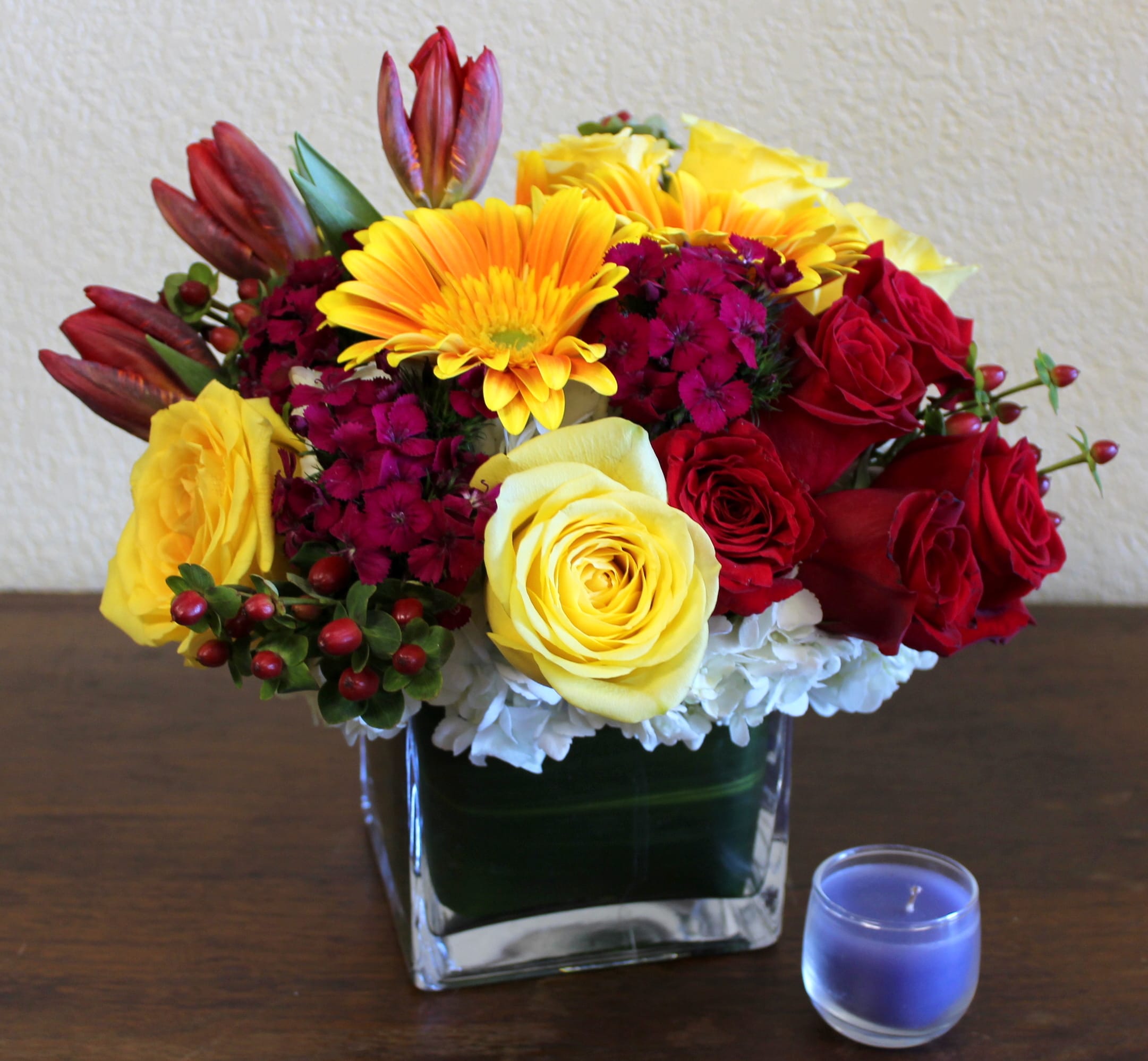 Summer Splender - Ruby red roses, tulips, touches of magenta, and yellows to brighten any day!