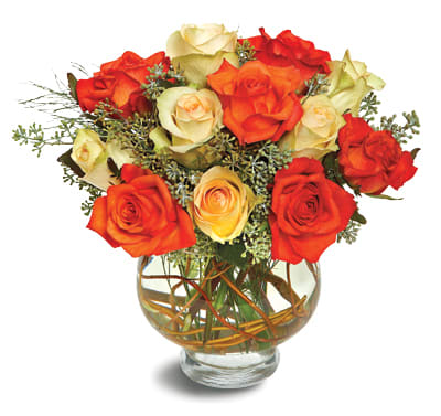 Harvest Moon Roses - The harvest moon is round and orange-gold, and this rounded display of orange and pale yellow roses, accented with seeded eucalyptus and presented in a vase decorated with vines, is reminiscent of the prettiest full moon. A charming selection.