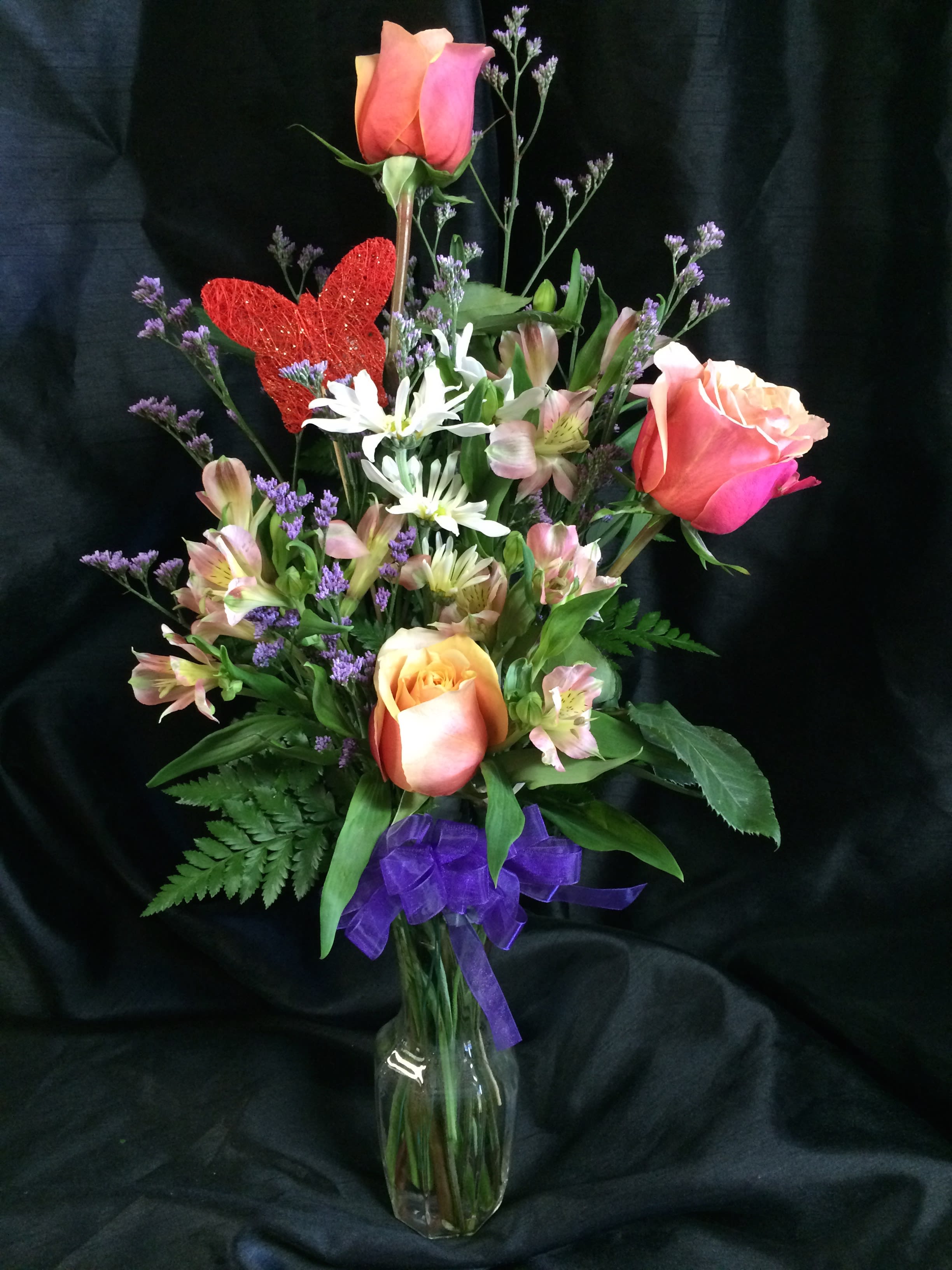 Sweet Moment of Roses - A bud vase of 3 premium roses with accent flowers.