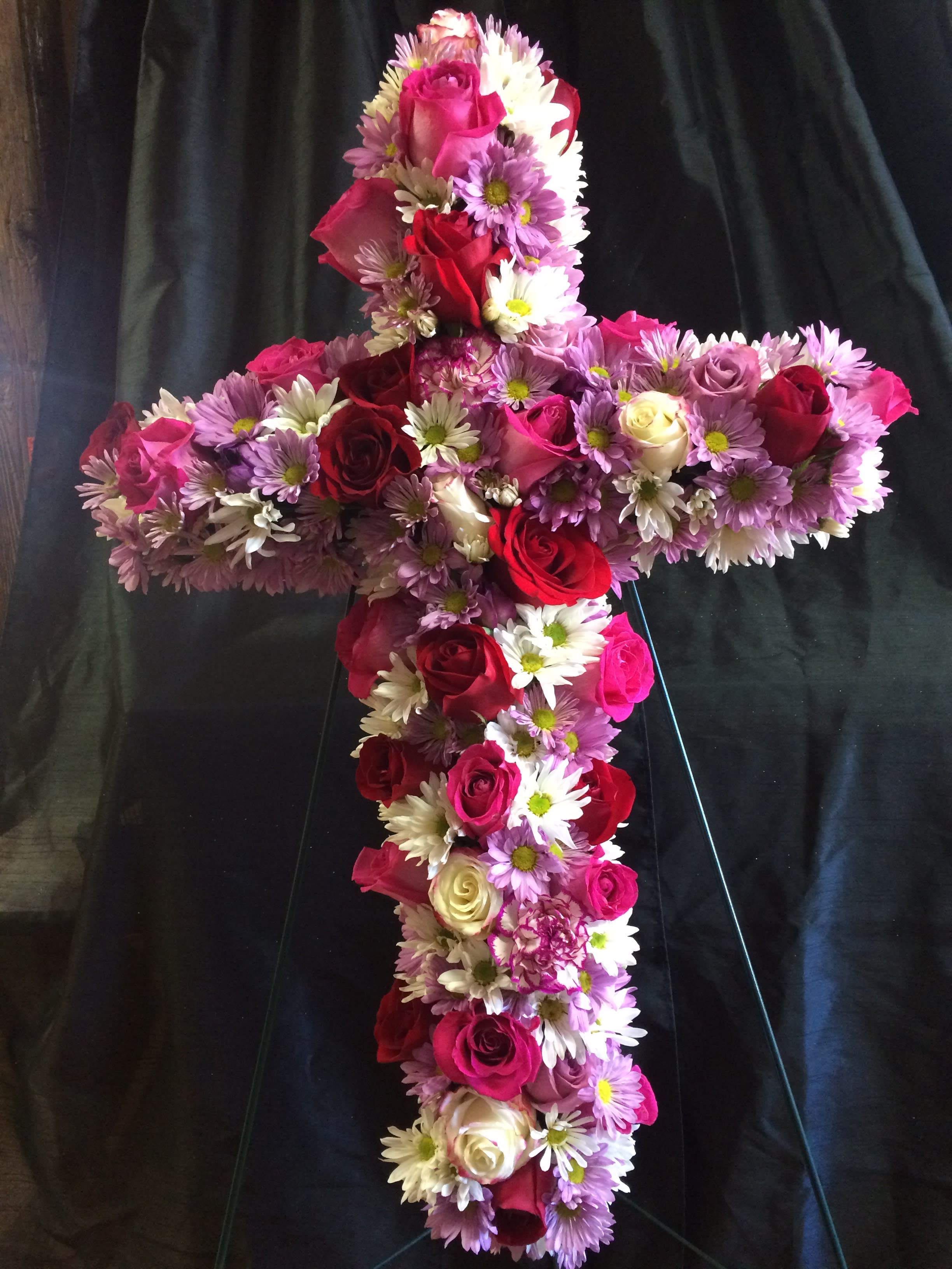 Faith - A beautiful cross full of flowers for your loved one.