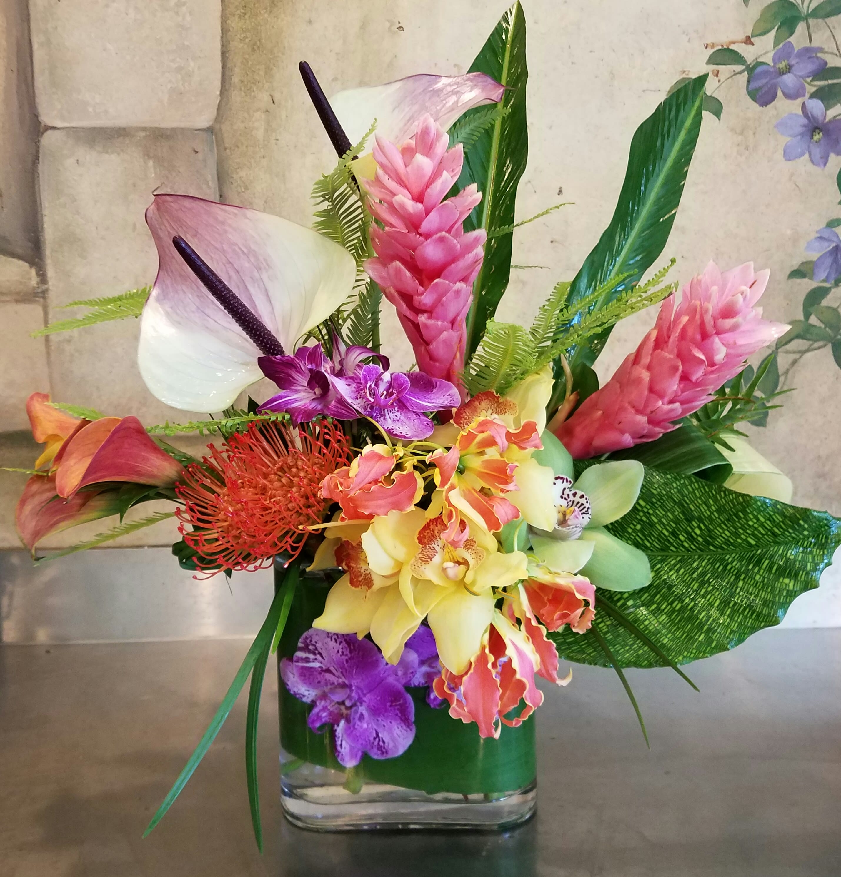 Tropicana  - Red ginger, tropical Greens, callas, anthiriums, and a mix of tropical orchids 