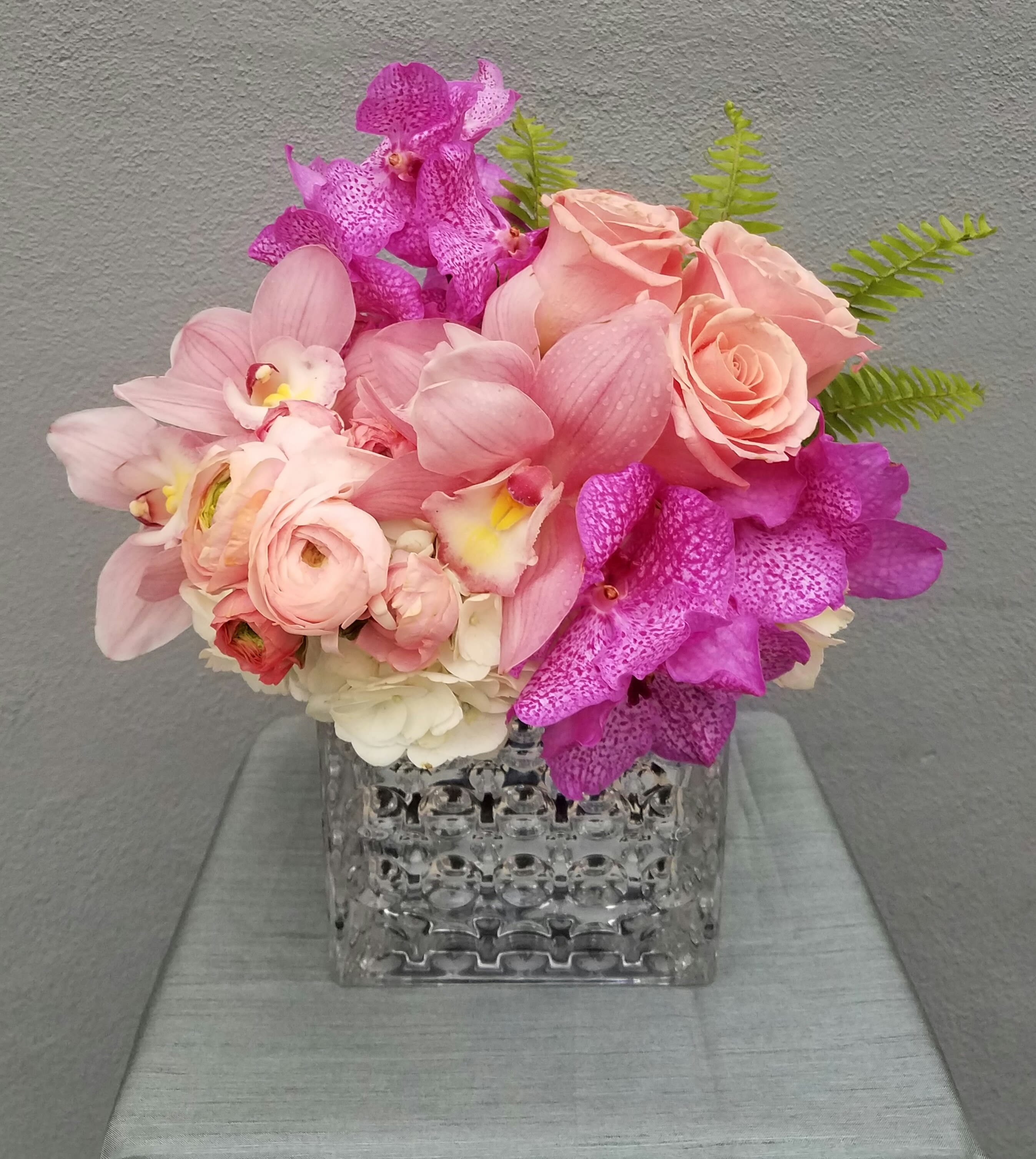 Serendipity - hydrangea, roses, cymbidium orchids,vanda orchids and tropical leaves 
