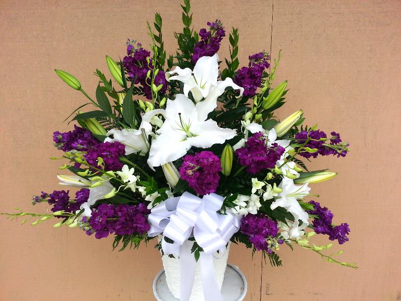 Purple and White Orchid basket - this large basket has purple stock flower with large white lilies and white orchids.