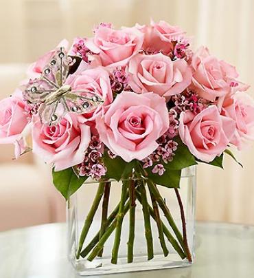 Modern Roses - One Dozen Pink Modern Roses - One Dozen Pink - Surprise her (or any Mom you know) with this contemporary spin on the traditional dozen roses. Stunning pink roses, gathered by our florists in a chic rectangular glass vase and accented with a fashionable butterfly pick. (Vase/Basket style may vary) Item # 91113