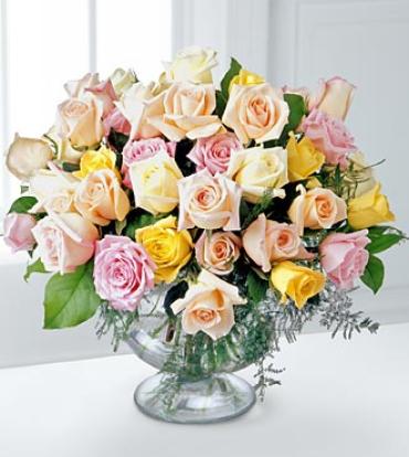 Display Of Affection Arrangement Display Of Affection Arrangement - Send expressions of comfort with this refined bouquet of mixed color roses. Soft pastel roses are affectionately arranged with greens in a glass pedestal vase. Appropriate to send to the residence, funeral home, or memorial service. Item # S23-3140
