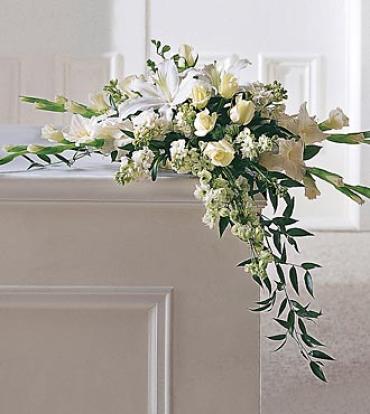 Graceful Tribute Arrangement Graceful Tribute Arrangement - When searching for an appropriate bouquet for the home, this all white lily, rose, and gladiolus arrangement is an excellent choice. This one-sided design drapes gracefully from a table edge or mantletop. Item # S11-3183