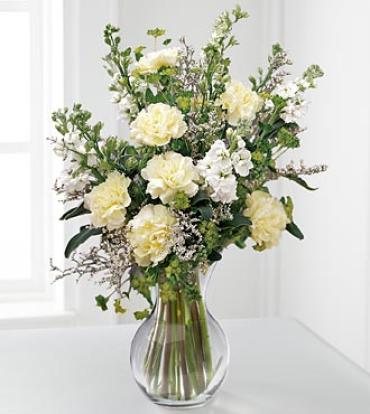 In Loving Memory Arrangement In Loving Memory Arrangement - Soft white larkspur and stock are arranged with creamy carnations in a glass vase to create a soothing bouquet. Appropriate for the residence, funeral home, or memorial service. Item # S35-3134