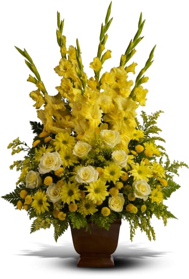 Sunny Memories Sunny Memories - Celebrate your sunny memories of someone special with this tall funeral floral arrangement, presented in a graceful urn. The sunny yellow flowers are a classic statement of never-ending friendship and love. Item # T219-1A