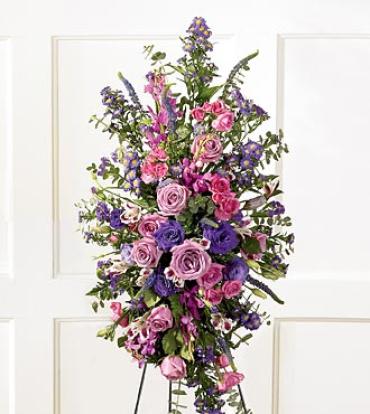 Blessings of the Earth Easel Blessings of the Earth Easel - Jewel-toned hot pink and lavender roses, fuchsia Mokara orchids, purple lisianthus, Veronica and statice are accented with baby blue eucalyptus in this beautiful spray. Item # S17-4221