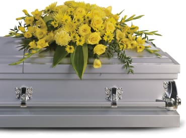 Graceful Grandeur Casket Spray Graceful Grandeur Casket Spray - Joyous times and golden memories are recalled with this lovely half-couch casket spray that consoles the bereaved and hints at the promise of sunshine and brighter days ahead. Item # T242-1A
