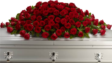 Greatest Love Casket Spray -  Express your love and devotion with the traditional elegance of this stunning red rose casket spray. Ideal for a full couch or closed casket service, the impressive display features a generous array of bold, beautiful blooms.    Item # T223-1A 