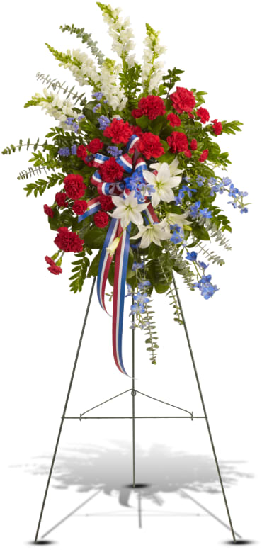 Sacred Duty Spray Sacred Duty Spray - Sparkling like an Independence Day fireworks display, a striking red, white and blue spray stands tall proud and patriotic. Bearing the colors of our nation's flag, it's a grand and fitting tribute to members of the military and American heroes. Item # T240-2A