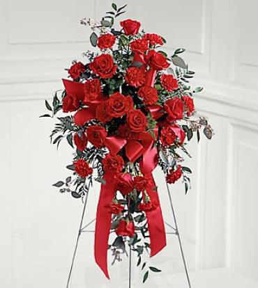 Sweet Thought Standing Spray Sweet Thought Standing Spray - Red carnations and red roses are elegantly arranged and accented with a ribbon in this beautiful spray. Arrangement is delivered on an easel and is appropriate to send to a funeral home or service. Item # S6-3442