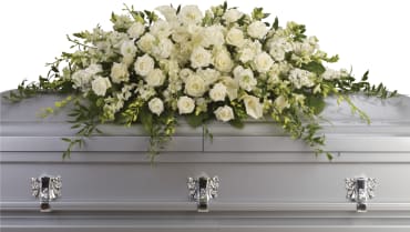 Purity and Peace Casket Spray Purity and Peace Casket Spray - The peaceful purity of this all white casket spray is a touching, inspiring way to honor the departed. Large in scale, the lush arrangement is ideal for a full couch or closed casket service, featuring elegant white blooms such as calla lilies, dendrobium orchids and hydrangea. Item # T229-3A
