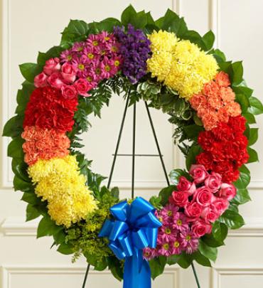 Bright Wreath Bright Wreath - Reflect your love and sympathy with this gorgeous hand-designed wreath in a rainbow of fresh, bright-toned blooms. (Vase/Basket style may vary) Item # 91393
