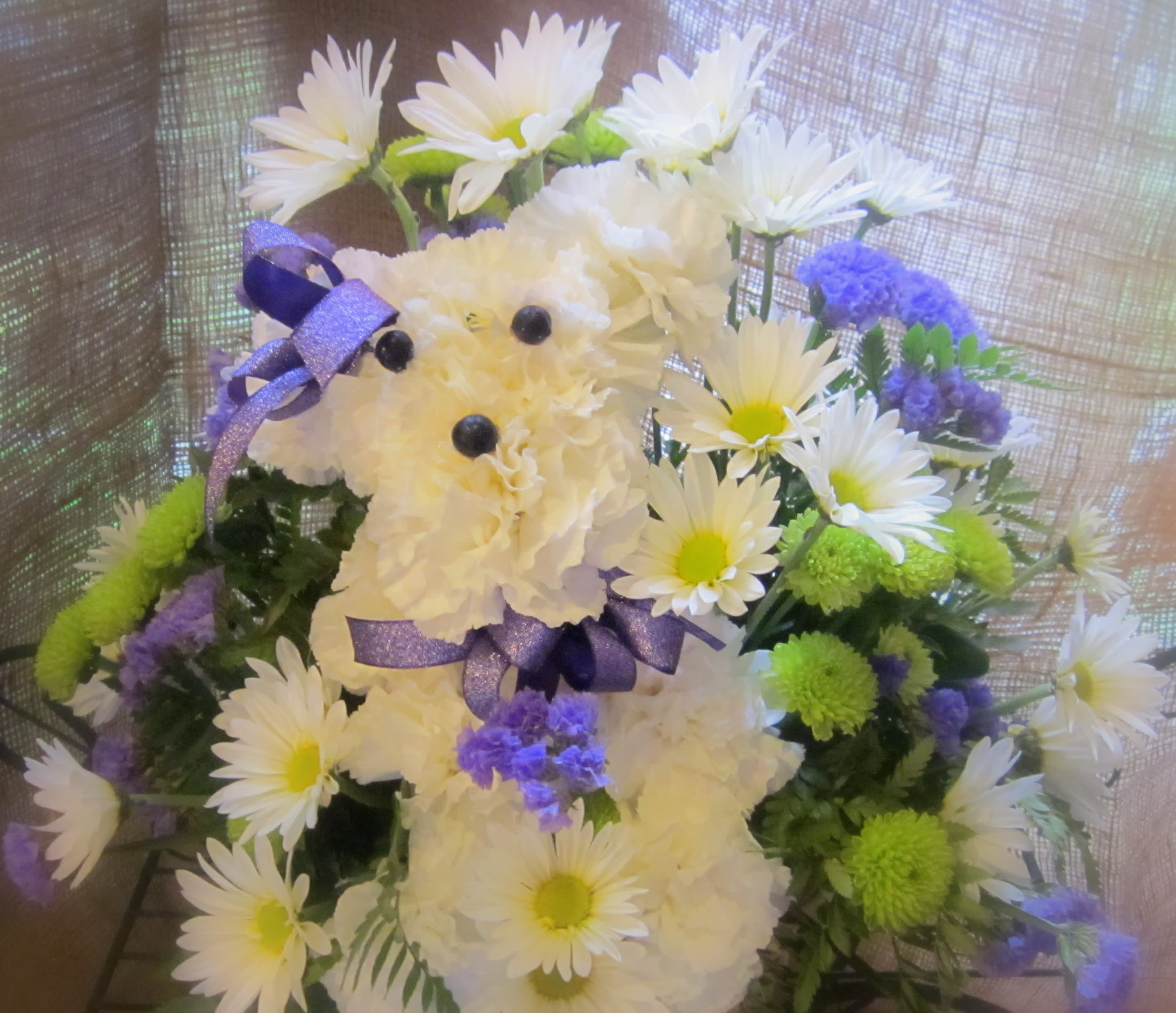 Poodle in a Basket - Send this adorable arrangement of carnations, daisies and  green buttons! 