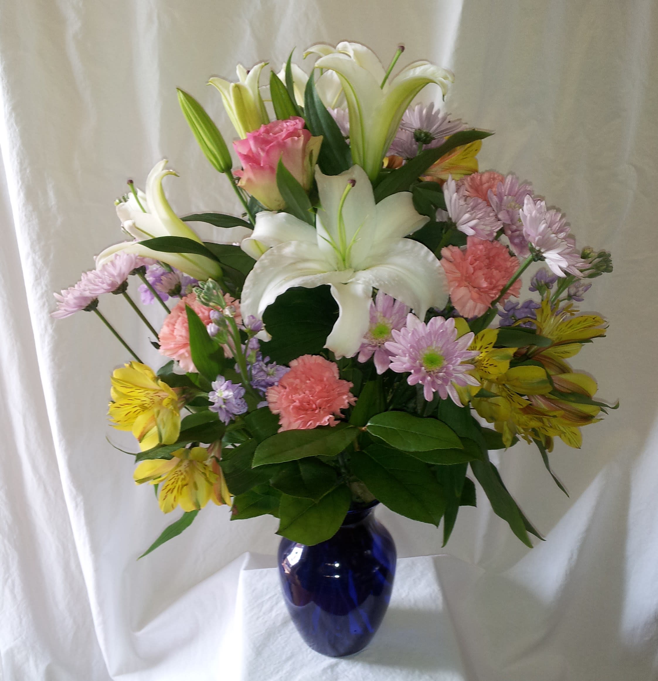 Fresh Spring - White lilies, carnations, mums, and greens