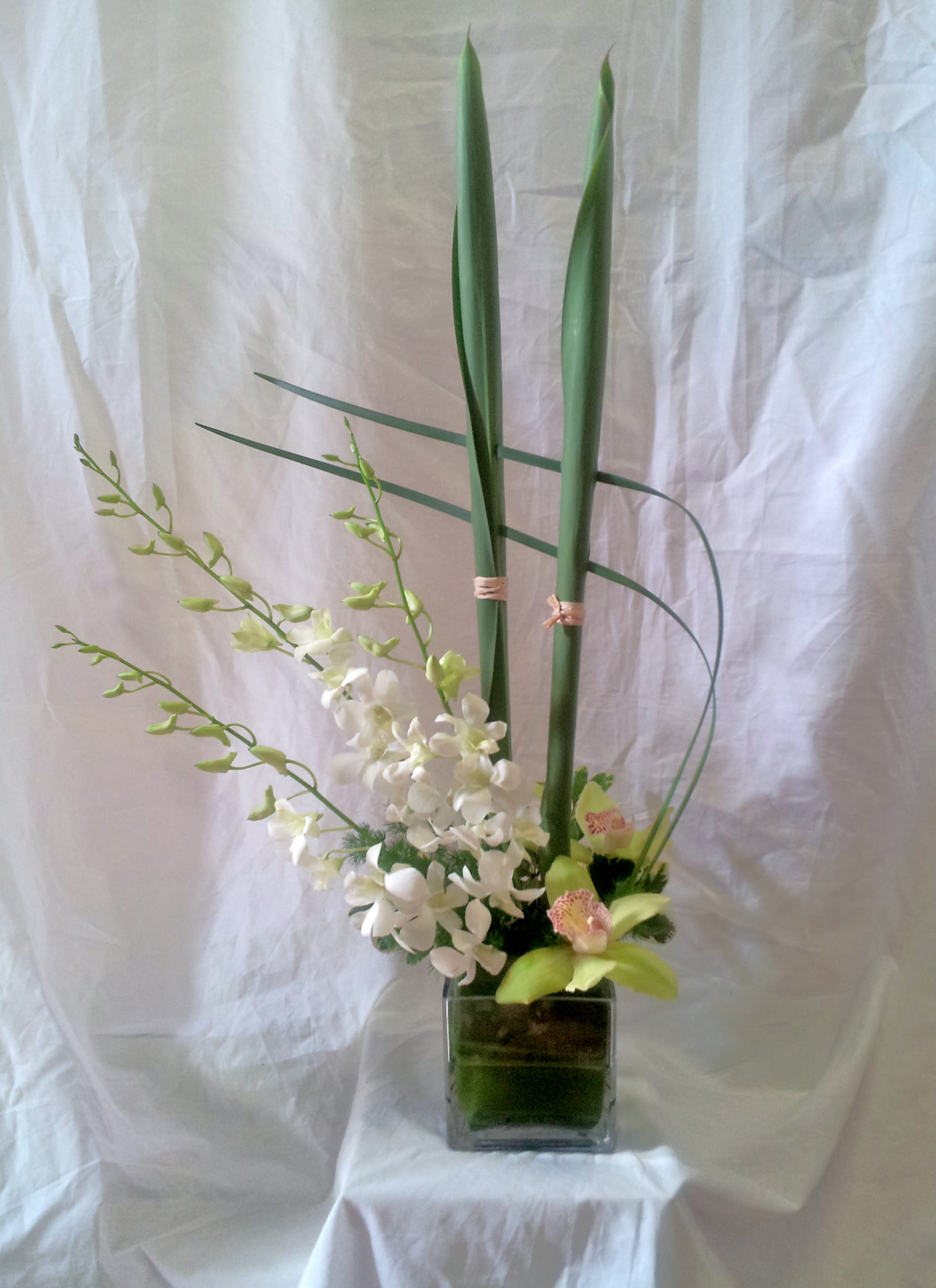 Asian Artistry Asian Artistry - Dendrobium and cymbidium orchids in a stylized glass cube