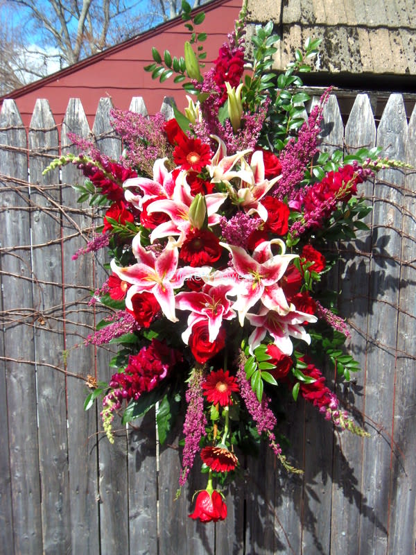Radiant Red Spray - Funeral Spray with red roses, stargazer lilies, burgundy snapdragons,  red gerbera, and heather