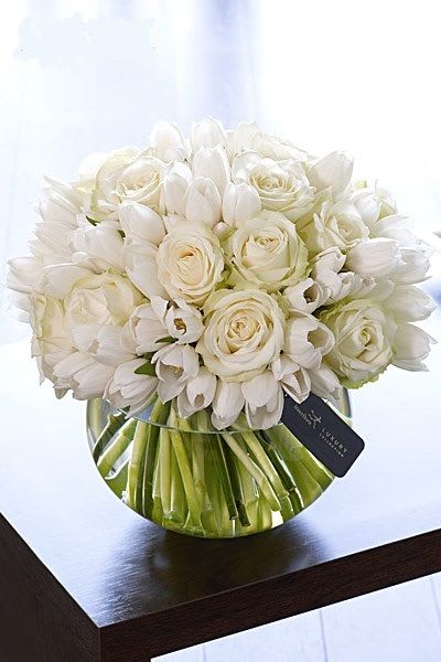 Luxury You Can Count On Luxury You Can Count On - An all white arrangement luxuriously displayed in an elegant glass bubble bowl. White roses and tulips that have a dramatic impact in any room. Call us with questions.