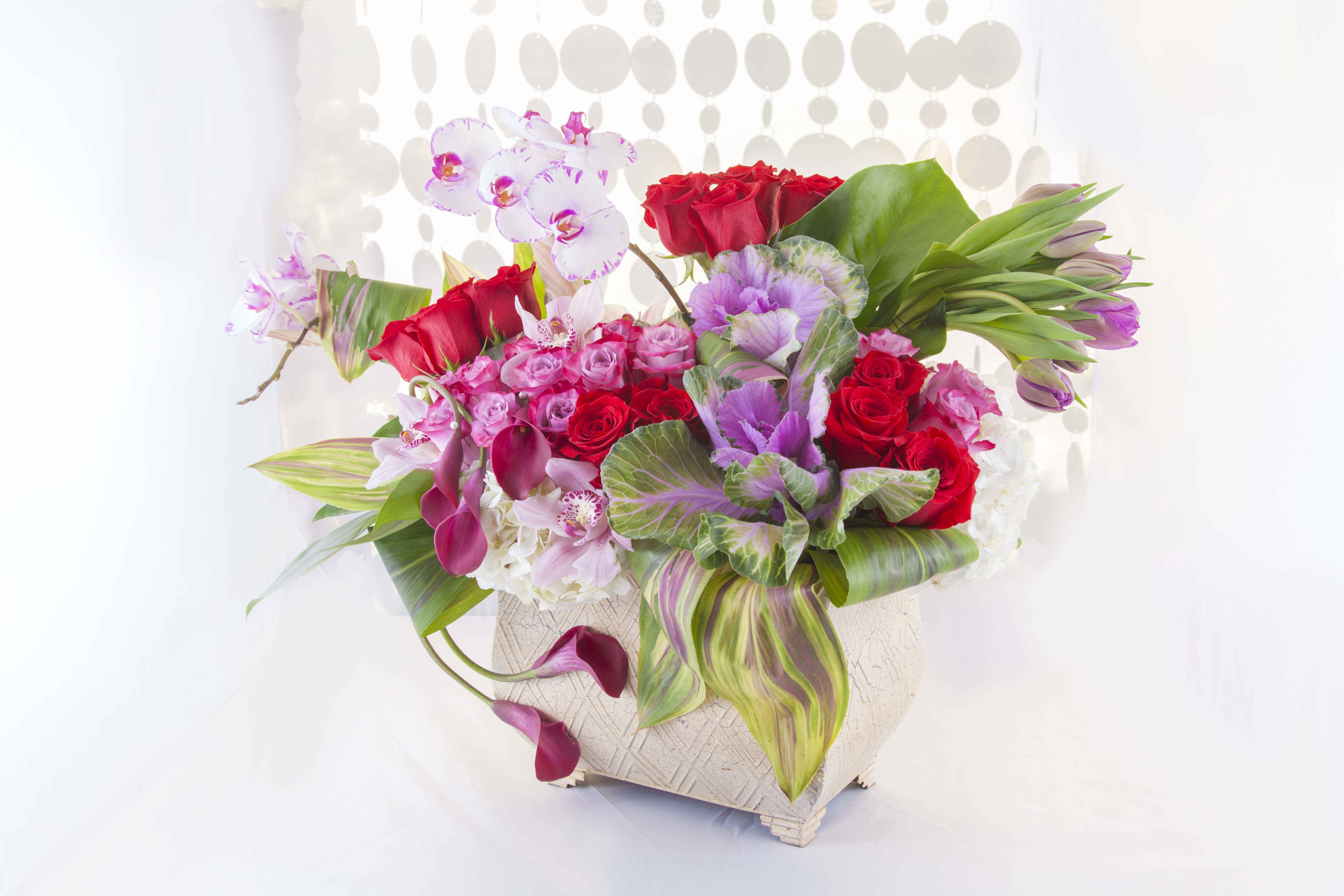 Modern Romance Modern Romance - Assortment of roses, orhchids, and hydrangeas.