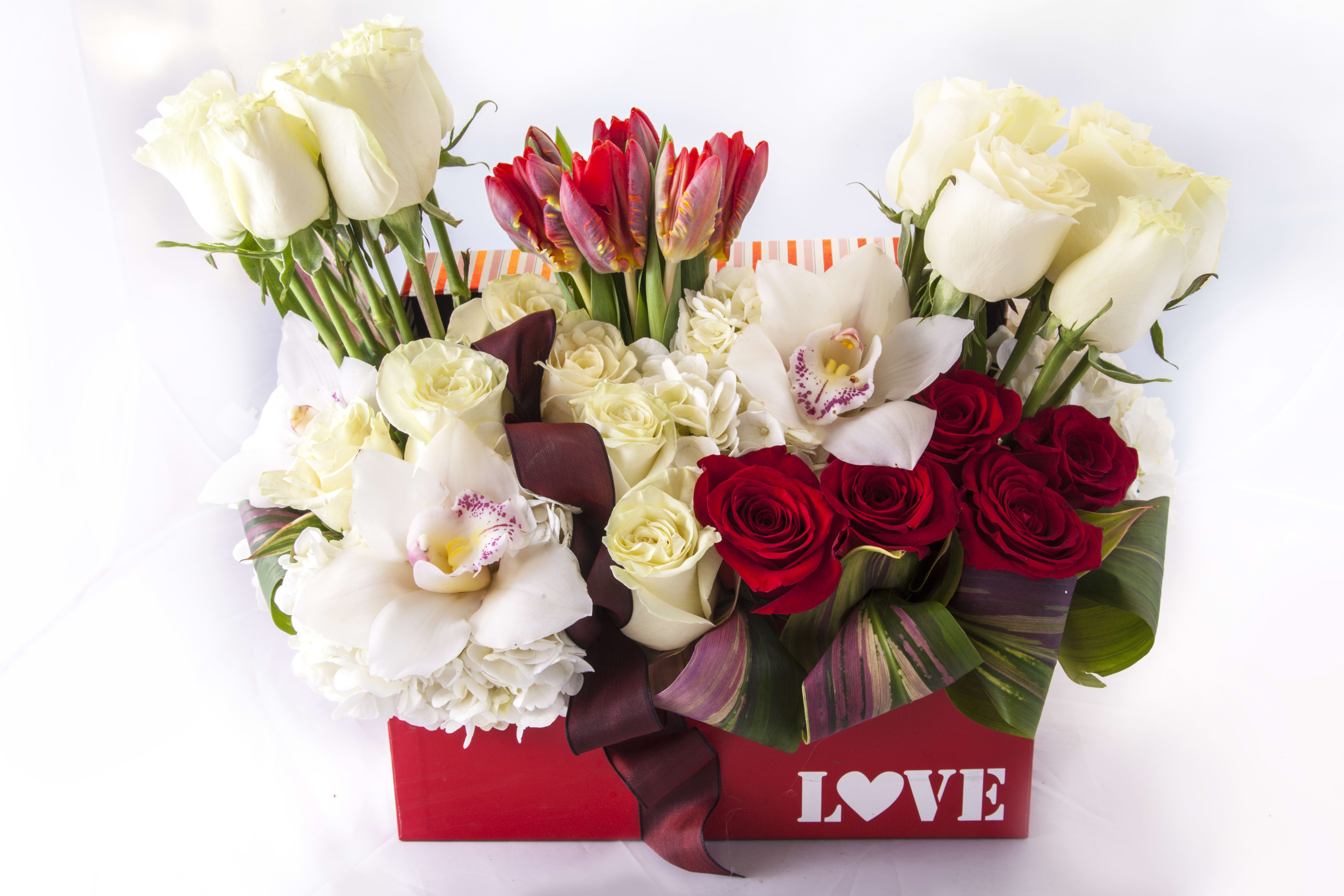 Classic Valentine Classic Valentine - Assortment of red and white roses.