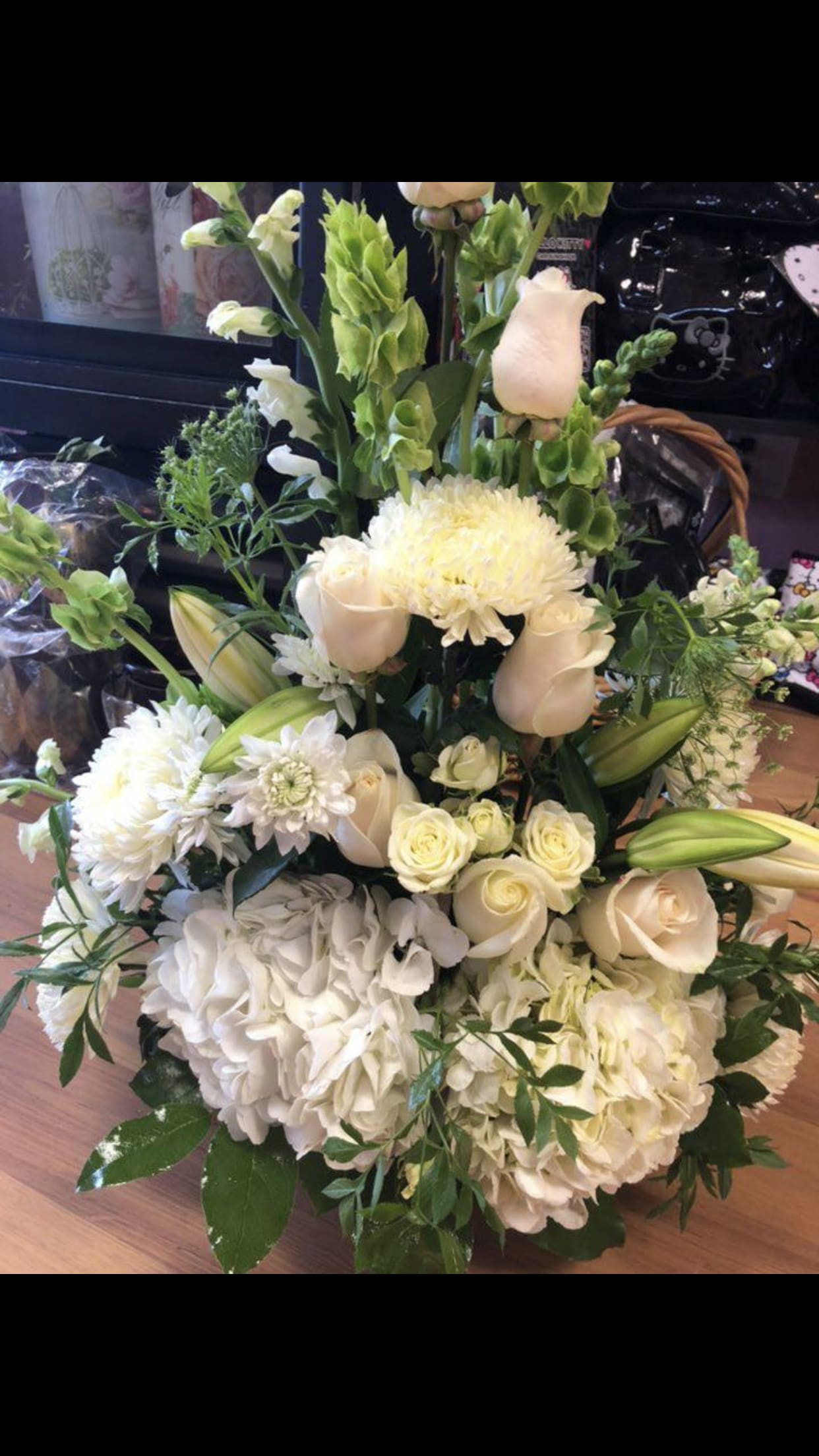 White sympathy arrangement White sympathy arrangement - Beautiful white funeral arrangement arranged in a white basket or white ceramic container