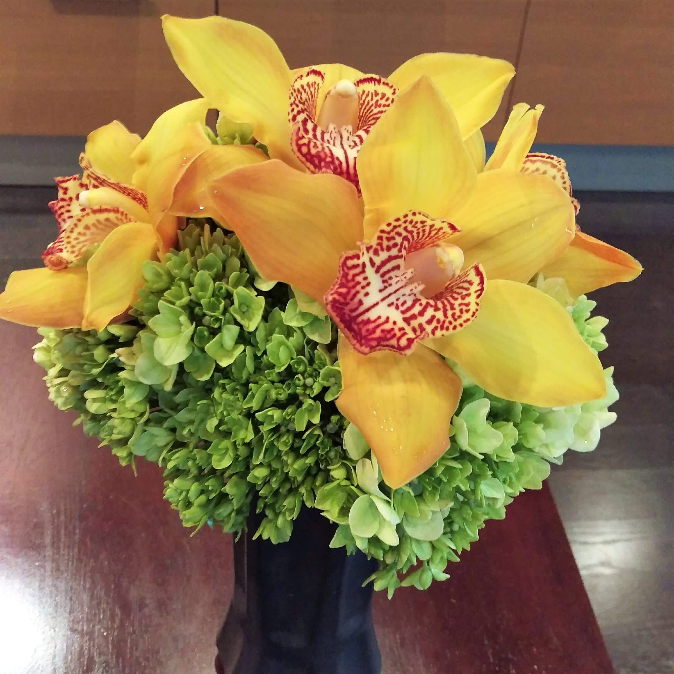 Kaye - Hydrangea &amp; cymbidium orchids in a black glass container