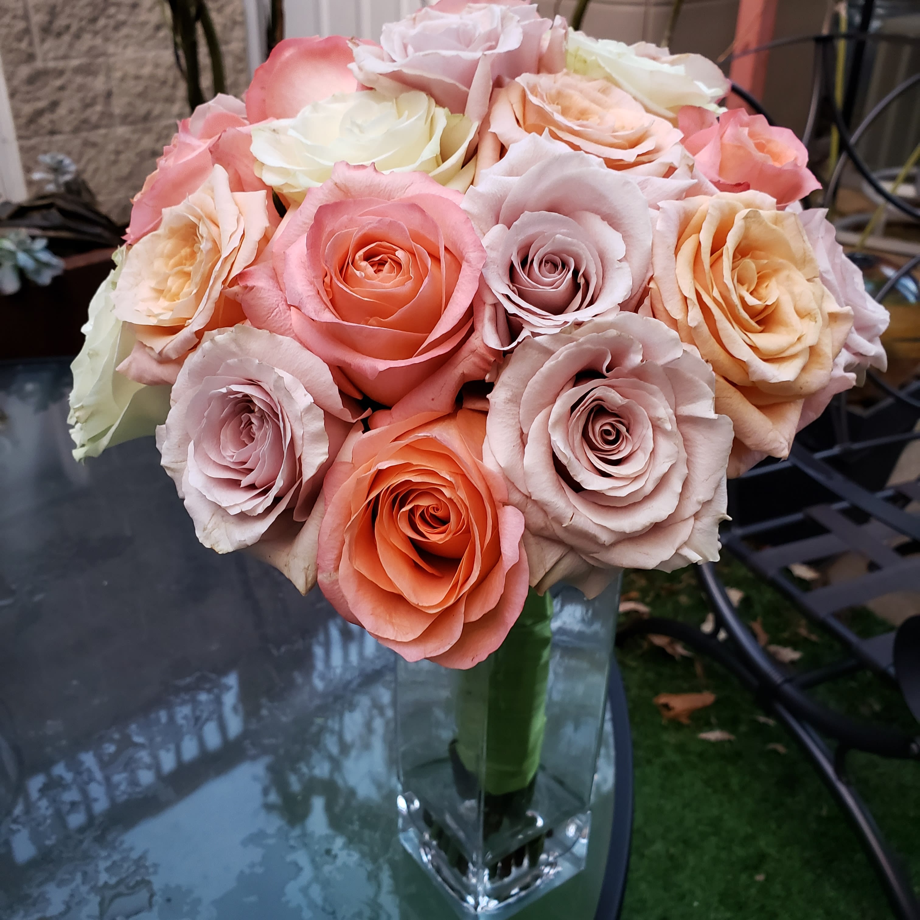 BooQuet  - Shades of peach, pink &amp; cream roses hand wrapped with a satin ribbon in a square tall glass container. (24stems)