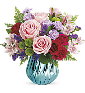 Sparkle And Bloom Bouquet - Make a glamorous statement with this sweet pop of pink roses, artistically hand-arranged in a mirrored ceramic vase. Its fresh aqua hue and unique faceted design truly sparkle! This sparkling bouquet includes light pink roses, hot pink spray roses, light pink alstroemeria, lavender miniature carnations, green button spray chrysanthemums, purple sinuata statice, lemon leaf and leatherleaf fern. Delivered in a Gem of My Heart vase. Approximately 13 1/2&quot; W x 12 1/4&quot; H 