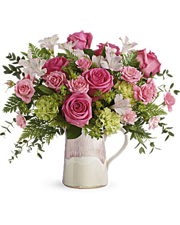 Heart Stone Bouquet Heart Stone Bouquet - Hot pink roses and fresh greens look oh-so-chic in this stylish stoneware pitcher, featuring an iridescent reactive glaze in the prettiest shade of pink. It's food-safe for years of enjoyment! Hot pink roses, pink spray roses, light pink alstroemeria, are arranged with bupleurum, leatherleaf fern, and parvifolia eucalyptus.