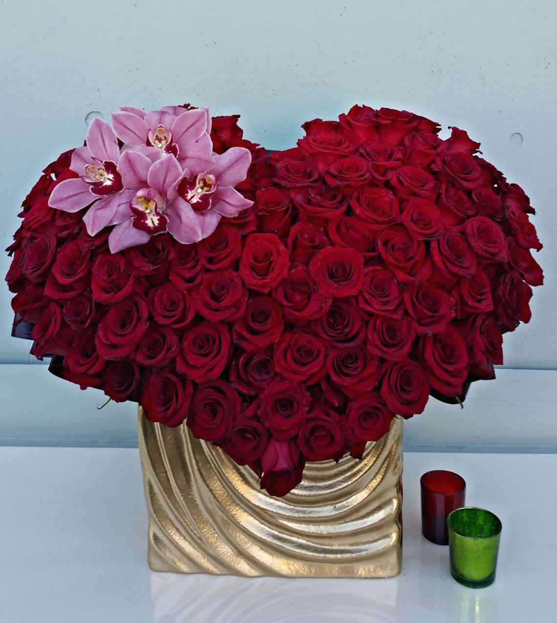 Enchanted Love Enchanted Love - Abundance of approx 125 red roses and orchids to make a heart shape for your loved one!