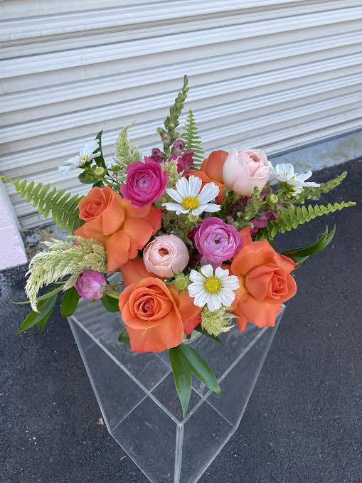 Socially Distant - DUE TO COVID-19, AVAILABILITY MAY VARY. PLEASE CALL FOR DETAILS. ALL ARRANGEMENTS WILL BE DESIGNER'S CHOICE. DELIVERY DATE AVAILABILITY IS SUBJECT TO CHANGE  Variety of premium blooms in a glass vase.  This low and lush designer's choice arrangement is hand crafted in Las Vegas by our all-women design team using the freshest high end florals from around the world. Our arrangements are created with love and delivered with care for you!