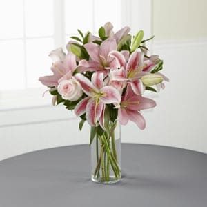 The FTD® Always &amp; Forever™ Bouquet -  Like a lovely floral “hug,” this blushing bouquet delivers your sincerest condolences in a way that’s sure to comfort the pain of loss. Simple and beautiful, this composition handcrafted by an FTD artisan florist of pink roses and pink Asiatic lilies enhanced with lush greens is arranged in a clear glass cylinder vase. It makes an excellent choice for expressing your sympathy at a wake, for the funeral service or to console family and friends at home. 